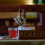 Image of reserved restaurant table | What Successful Coaches Know That Keeps Them Fully Booked