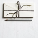Image of a gift box and pencil | Why Your Best Clients Don’t Care About Your Credentials