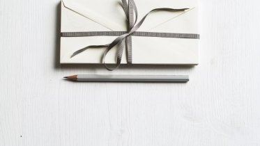 Image of a gift box and pencil | Why Your Best Clients Don’t Care About Your Credentials