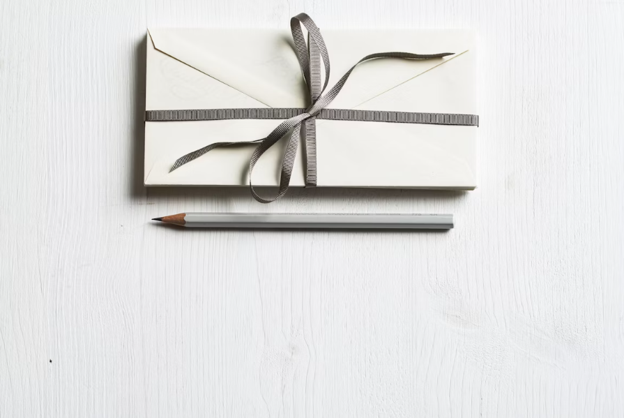Image of a gift box and pencil | Why Your Best Clients Don’t Care About Your Credentials