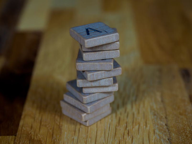 Image of stacked metal pieces on wood | The Minimal Marketing Stack for Coaches