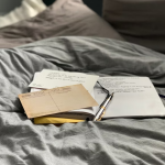 Image of books on a bed | Business Clarity for Coaches: The Secret to Making More and Working Less