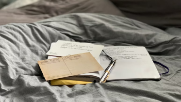 Image of books on a bed | Business Clarity for Coaches: The Secret to Making More and Working Less