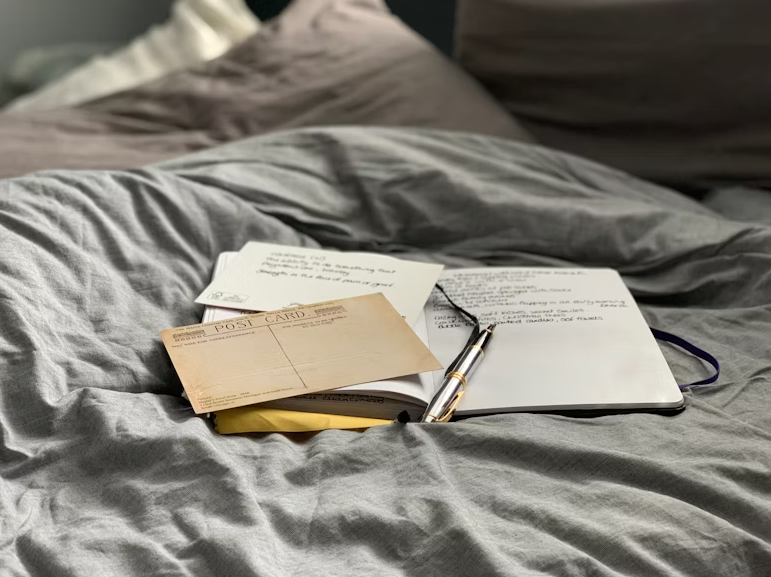Image of books on a bed | Business Clarity for Coaches: The Secret to Making More and Working Less