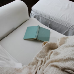 Image of a green book on couch | Why Doing Less Marketing Can Actually Create More Impact