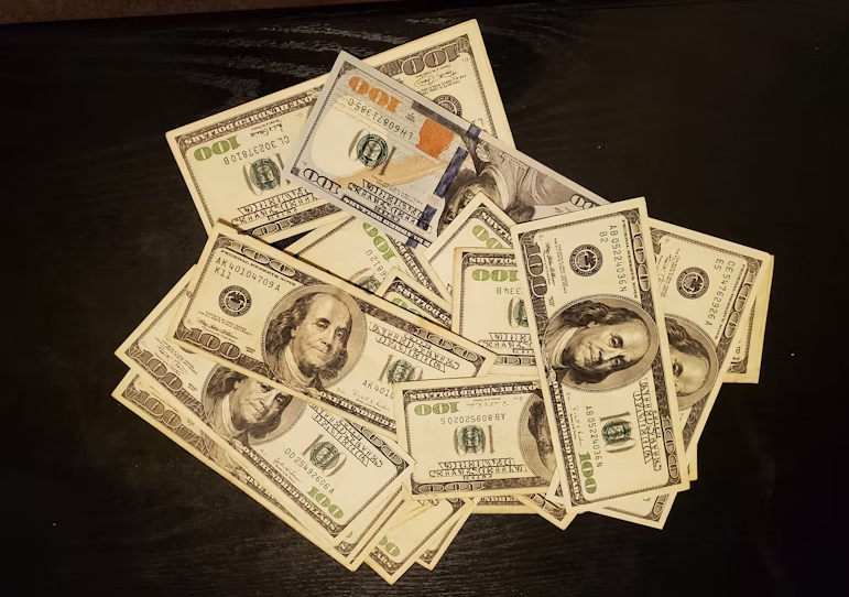 Image of dollar bills | Why “Get Rich Quick” Coaching Strategies Don’t Work
